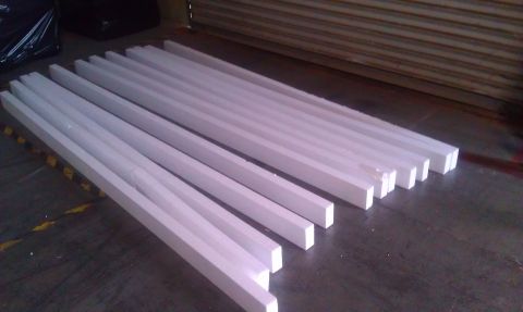 1989 Ford Bronco - Several white foam pieces are laid out in rows on a dark, industrial-looking floor.