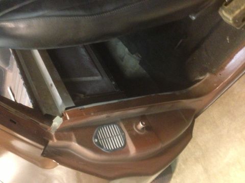 1972 Ford Ranchero - Interior view of a 1972 Ford Ranchero, focusing on the door panel and floor vent.