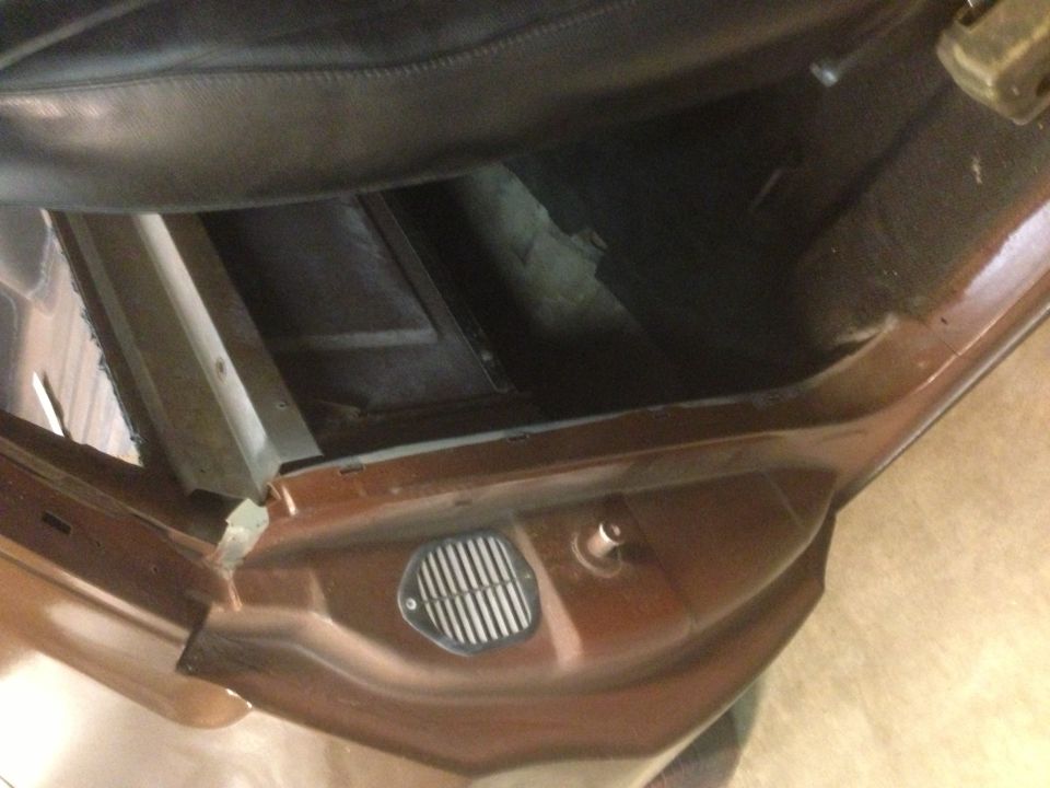 1972 Ford Ranchero interior showing brown door panel and floor vent