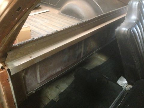 1972 Ford Ranchero - The interior of a vehicle shows the truck bed and a portion of the passenger seat.