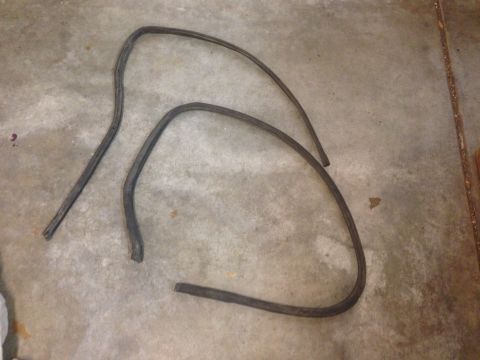 1972 Ford Ranchero - Two black rubber seals are shown lying on a concrete surface.