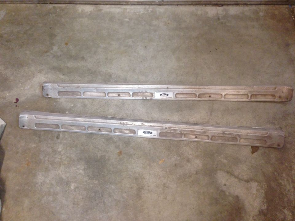 Pair of aluminum running boards with Ford emblems