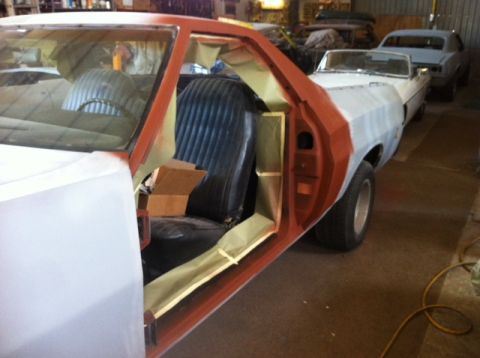 1972 Ford Ranchero - A 1972 Ford Ranchero is shown with its door open, revealing the interior and indicating it is in the process of bodywork.