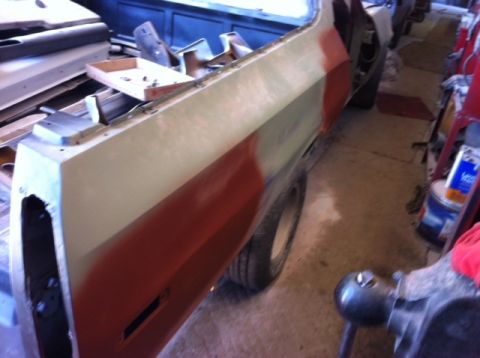 1972 Ford Ranchero - Side view of a 1972 Ford Ranchero undergoing bodywork and painting.