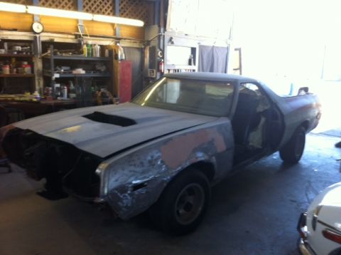 1972 Ford Ranchero - This 1972 Ford Ranchero is in a workshop, showing its current state of repair with the front end partially dismantled.