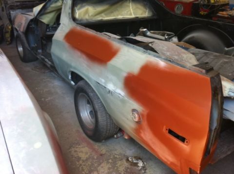 1972 Ford Ranchero - This 1972 Ford Ranchero is undergoing bodywork, showing primer and orange filler patches on its side.