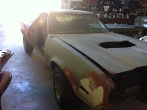 1972 Ford Ranchero - This vehicle is undergoing body repairs, with primer and filler visible on the fenders and hood.