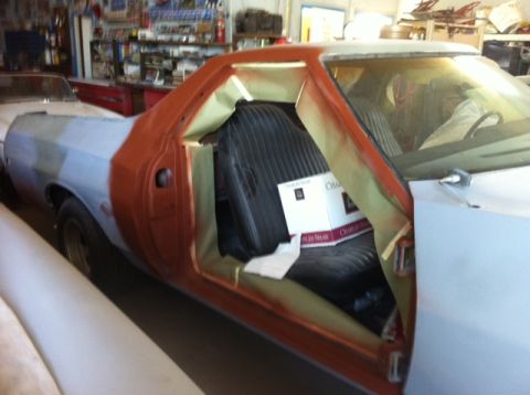 1972 Ford Ranchero - This 1972 Ford Ranchero is undergoing restoration, with its body in primer and the driver's side door ajar.