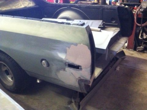 1972 Ford Ranchero - Rear quarter panel of a 1972 Ford Ranchero being prepped for paint, with primer and filler visible.