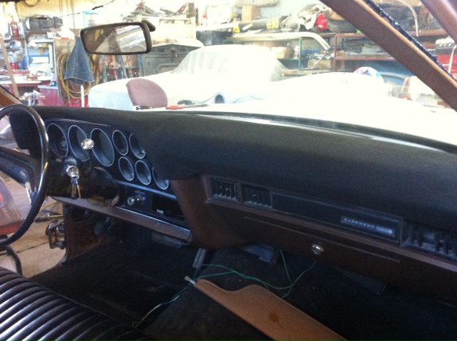 1972 Ford Ranchero interior, brown dashboard with round gauges and black steering wheel