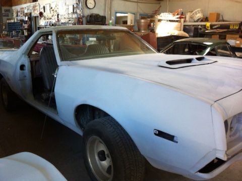 1972 Ford Ranchero - This Ford Ranchero is undergoing restoration in a workshop, with another vehicle visible behind it.