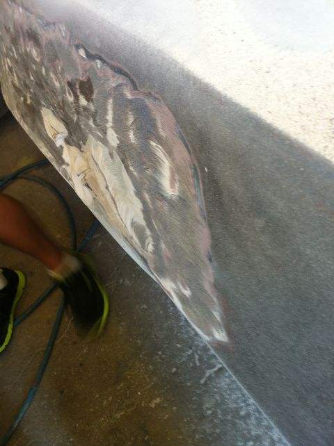 1972 Ford Ranchero - Body panel undergoing repair work, showing primer and sanding marks.