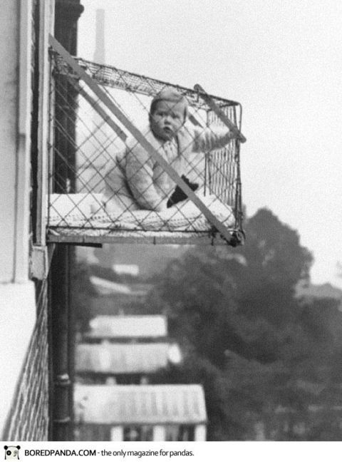 2006 Ford E350 - A baby is placed in a cage on a balcony for fresh air and safety.