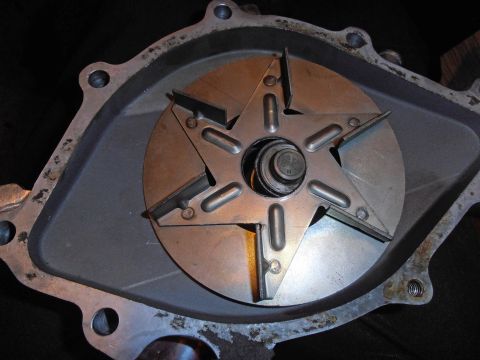 1990 Ford Bronco - Water pump impeller shown in detail, likely for a vehicle's cooling system.
