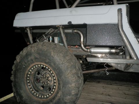 1961 International Scout 800 - Custom exhaust system installed on a heavily modified off-road vehicle.