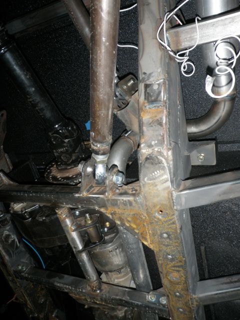 1961 International Scout 800 - Close-up view of the undercarriage, focusing on the frame, exhaust, and suspension elements.