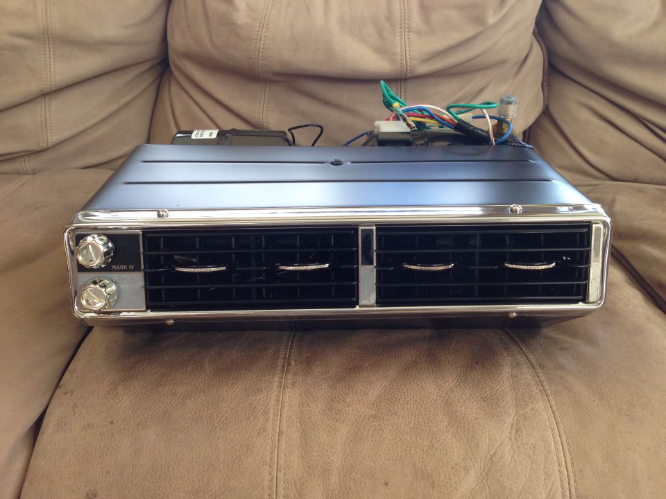 car AC unit with dual vents and two knobs labeled MARK IV