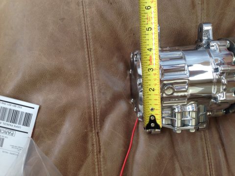 1964 Ford Fairlane - Chrome automotive part measured with a tape measure. USPS label visible.