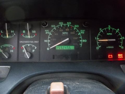 1995 Ford Bronco - A vehicle's dashboard displays various gauges and an odometer reading of 159,249.5 miles.
