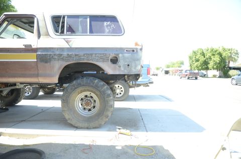 1979 Ford Bronco - Lifted 1978 Ford Bronco in need of restoration, parked outdoors with other vehicles.