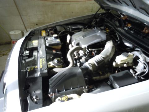 2001 Ford Crown Victoria - Engine bay of a silver sedan, with visible text indicating it is a "2004 Salem Car".