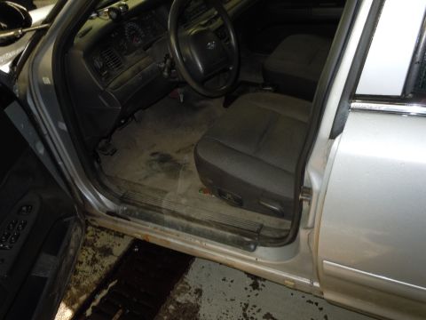 2001 Ford Crown Victoria - Interior view of a 2001 Ford Crown Victoria, focusing on the driver's side.