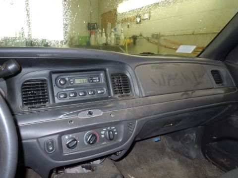 2001 Ford Crown Victoria - Interior view of a 2001 Ford Crown Victoria dashboard, showing the radio and climate controls.