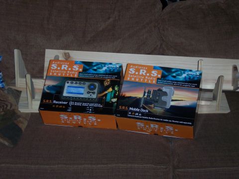 1990 Ford Bronco - The boxes display images of the satellite radio receiver and its mobile dock accessory.