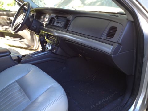 1998 Ford Crown Victoria - The interior of a car shows a "Marauder" branded floor mat, suggesting it may not be a 1998 Ford Crown Victoria.