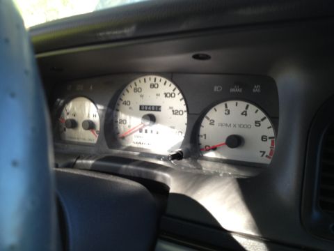 1998 Ford Crown Victoria - Interior view of a 1998 Ford Crown Victoria dashboard, showing the speedometer, tachometer, and odometer.