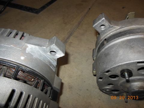 1979 Ford F-150 - A close-up view of two vehicle alternators, possibly for comparison or a swap.