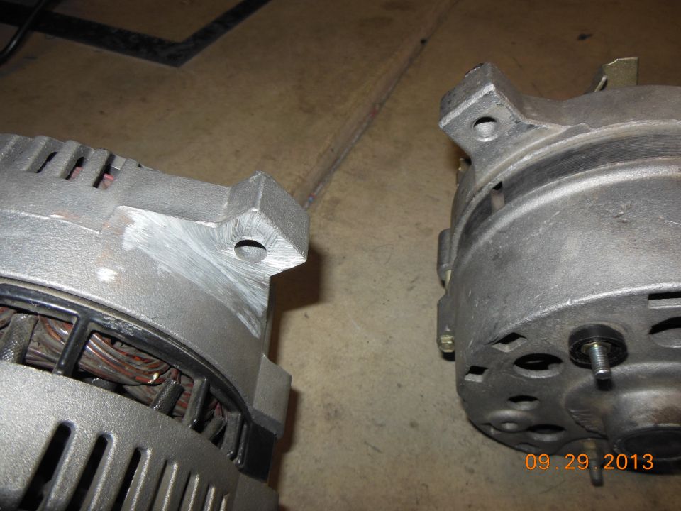 Two vehicle alternators side by side, one on the left, one on the right