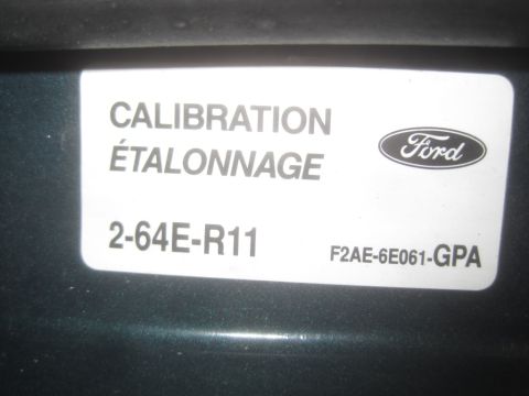 1993 Ford Bronco - Calibration sticker from a Ford part, showing part numbers and French translation.