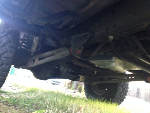 1992 Ford F-150 - This image shows the undercarriage of a truck, focusing on the radius arms and suspension system.