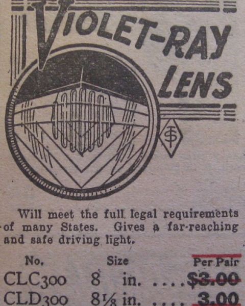 1915 Ford Model T - Advertisement for Violet-Ray Lens, detailing its legal compliance and driving light benefits.