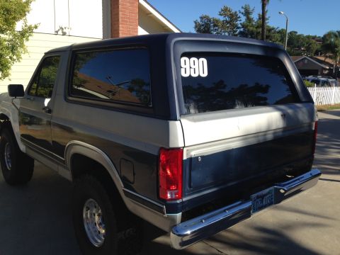1986 Ford Bronco - Rear view of a 1986 Ford Bronco with a '990' decal on the rear window.
