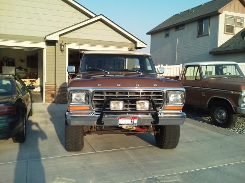 1979 Ford F-150 - This 1979 Ford F-150 is parked in front of a garage with another pickup truck to its right.