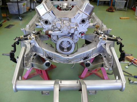 Chevrolet V8 engine mounted on a bare chassis with suspension components