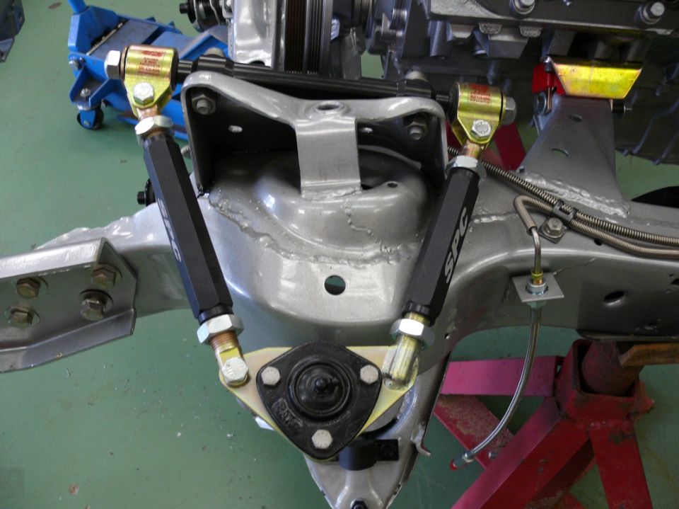 SPC upper control arms on a car's front suspension assembly