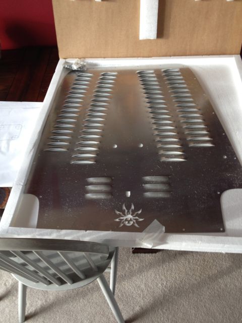 2005 Jeep Wrangler - A silver hood with multiple vents and a spider emblem is shown, packaged in a box.