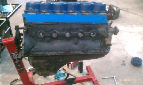 1983 Ford Bronco - Engine assembly sits on a stand in a workshop, ready for further work or installation.