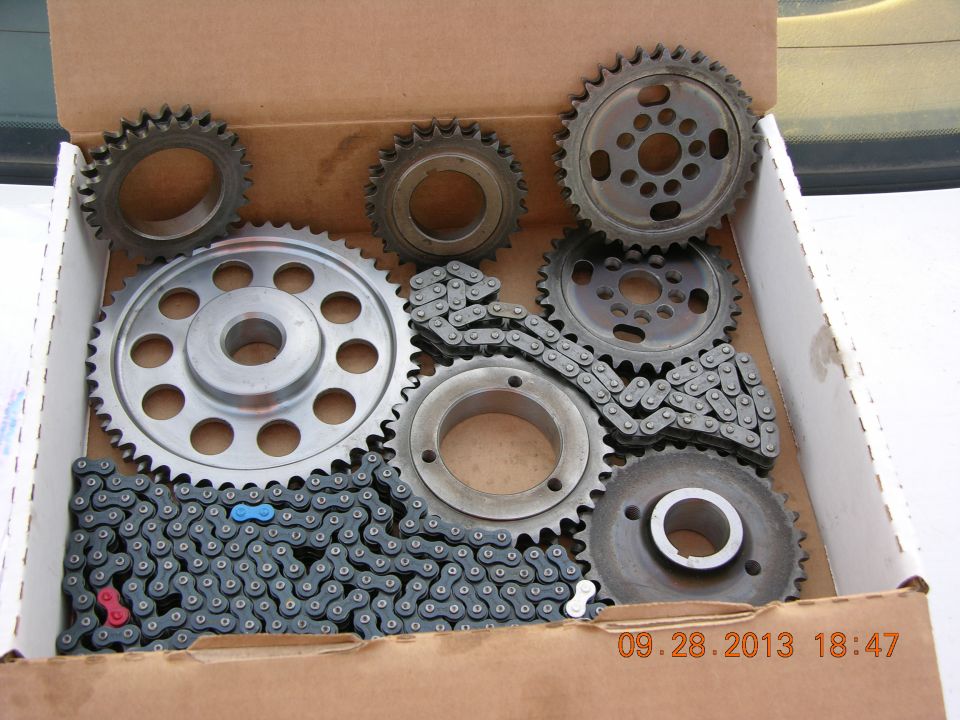 Timing chain and gears kit in a cardboard box with a date stamp
