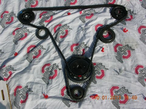 1969 Ford Fairlane - A timing chain and gear set is displayed on a cloth patterned with Ohio State University logos.