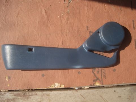 1993 Ford Bronco - This is a close-up of a blue plastic interior door handle trim piece.