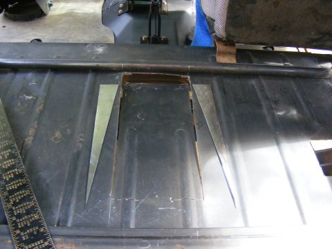Interior floor panel with cutouts and metal inserts, ruler visible