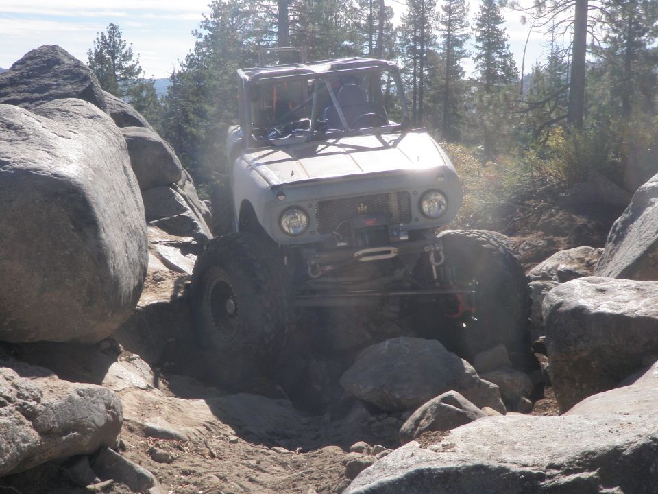 1961 International Scout 800 off-roading through rocks