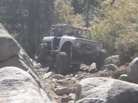 1961 International Scout 800 - Modified 1961 International Scout 800 navigating a challenging rocky trail.