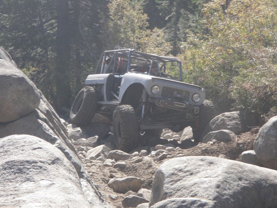 1961 International Scout 800 modified for off-roading, climbing over large rocks