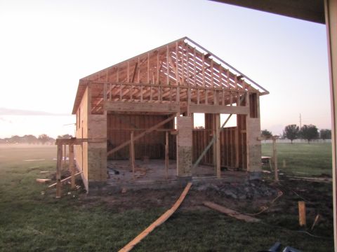1995 Ford Bronco - Building construction in progress, showing the wooden framing and open structure.