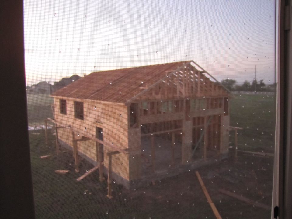 House under construction with wooden framing visible